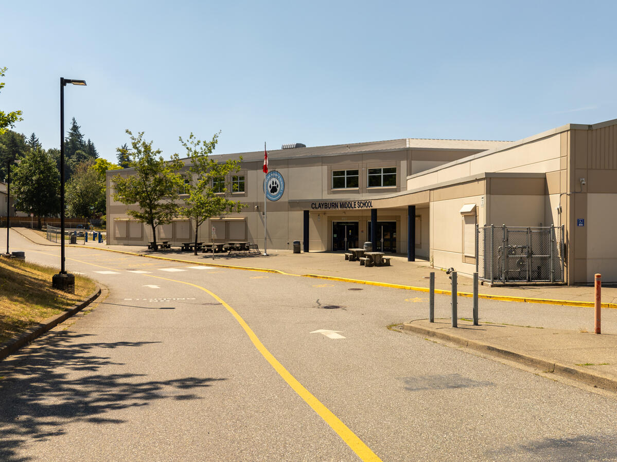 exterior image of a middle school in Abbotsford. The driveway that leads to the main entrance of the school.